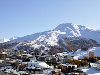 Panoramic view of Sestriere, with the Shackleton Mountain Resort (the cone-shaped structure at the bottom left) and beside the swimming pool of Sestriere