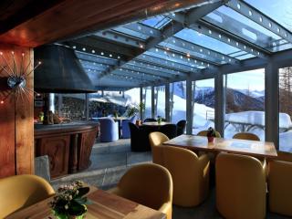 Restaurant with panoramic views. At the center of the room a large fireplace warms the room and heart.